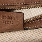 Bolso de hombro de bambú nuevo con asa superior y solapa de piel granulada color tostado