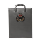 Bolso de mano Trick Track de piel granulada gris con tachuelas