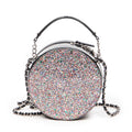 Bolso de hombro CC redondo de piel charol con purpurina negra y cadena cruzada