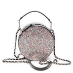 Bolso de hombro CC redondo de piel charol con purpurina negra y cadena cruzada