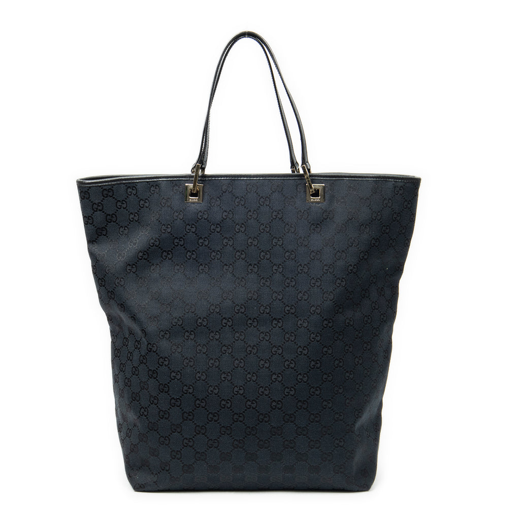 Bolso de mano grande vertical abierto de lona negra con monograma