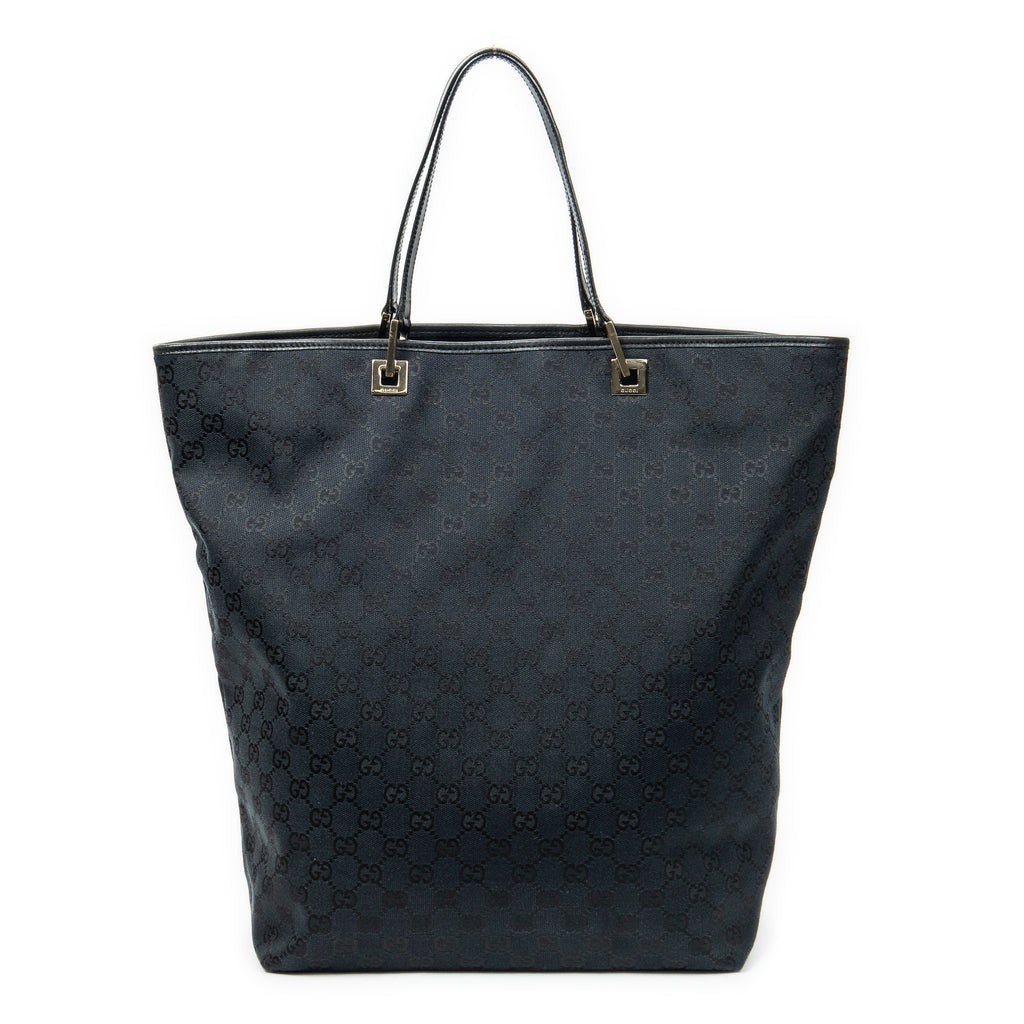 Bolso de mano grande vertical abierto de lona negra con monograma