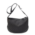 Bolso de hombro Messenger de media luna de lona vaquera negra con monograma