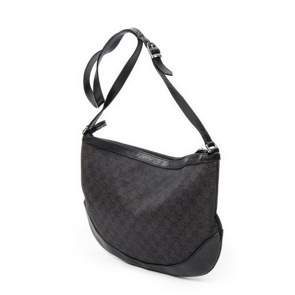 Bolso de hombro Messenger de media luna de lona vaquera negra con monograma