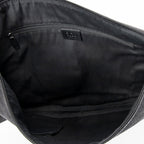 Bolso de hombro Messenger de media luna de lona vaquera negra con monograma