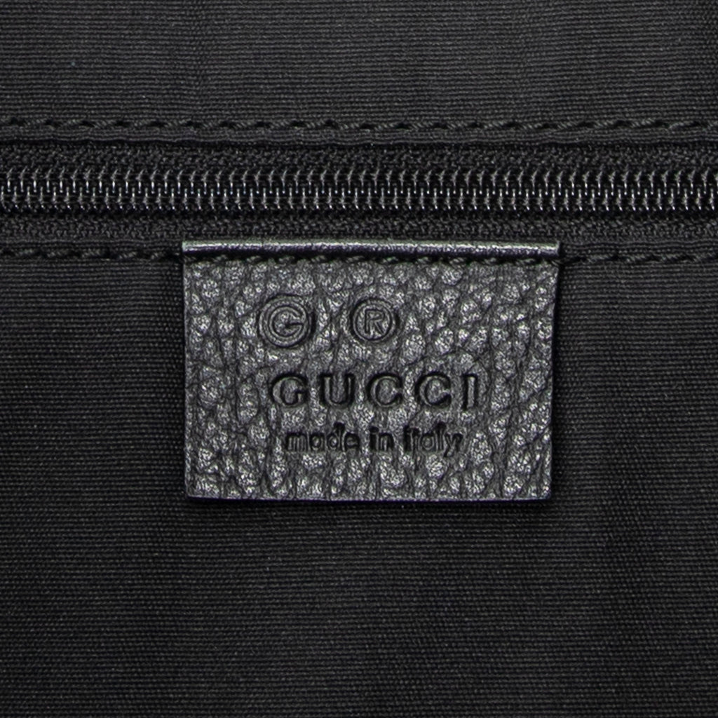 Bolso de hombro Messenger de media luna de lona vaquera negra con monograma