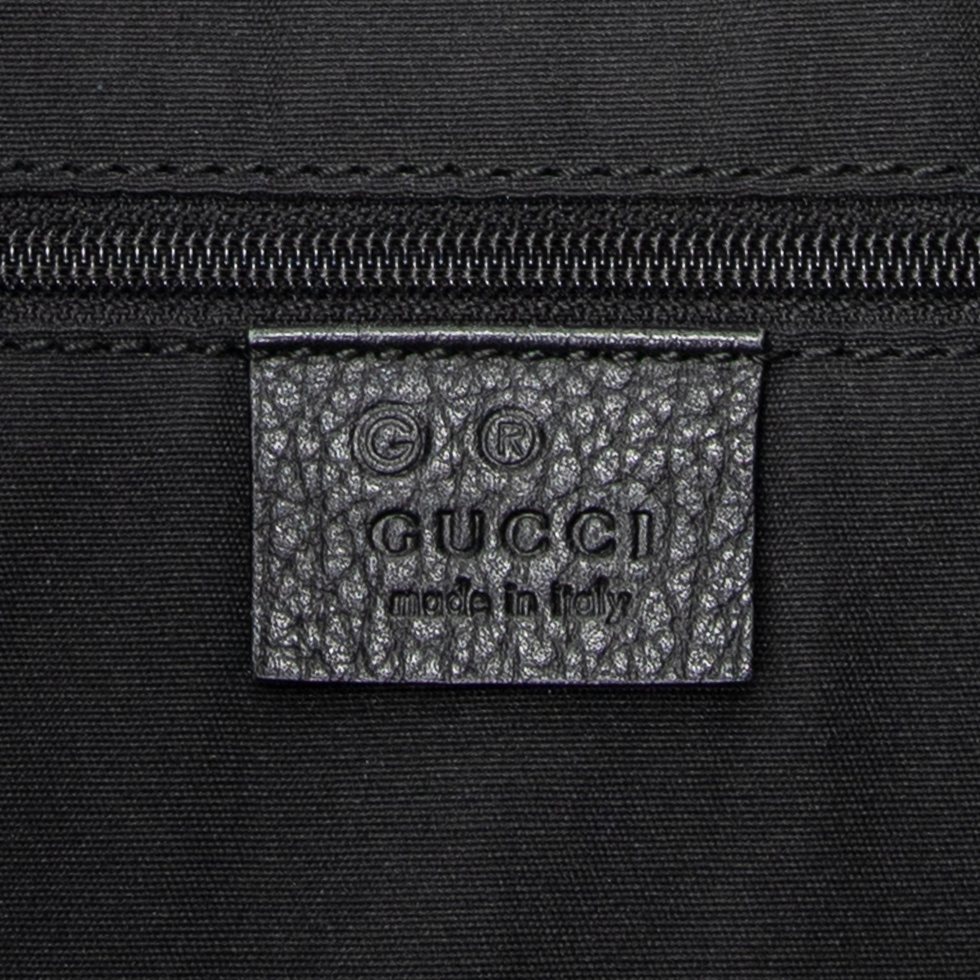 Bolso de hombro Messenger de media luna de lona vaquera negra con monograma