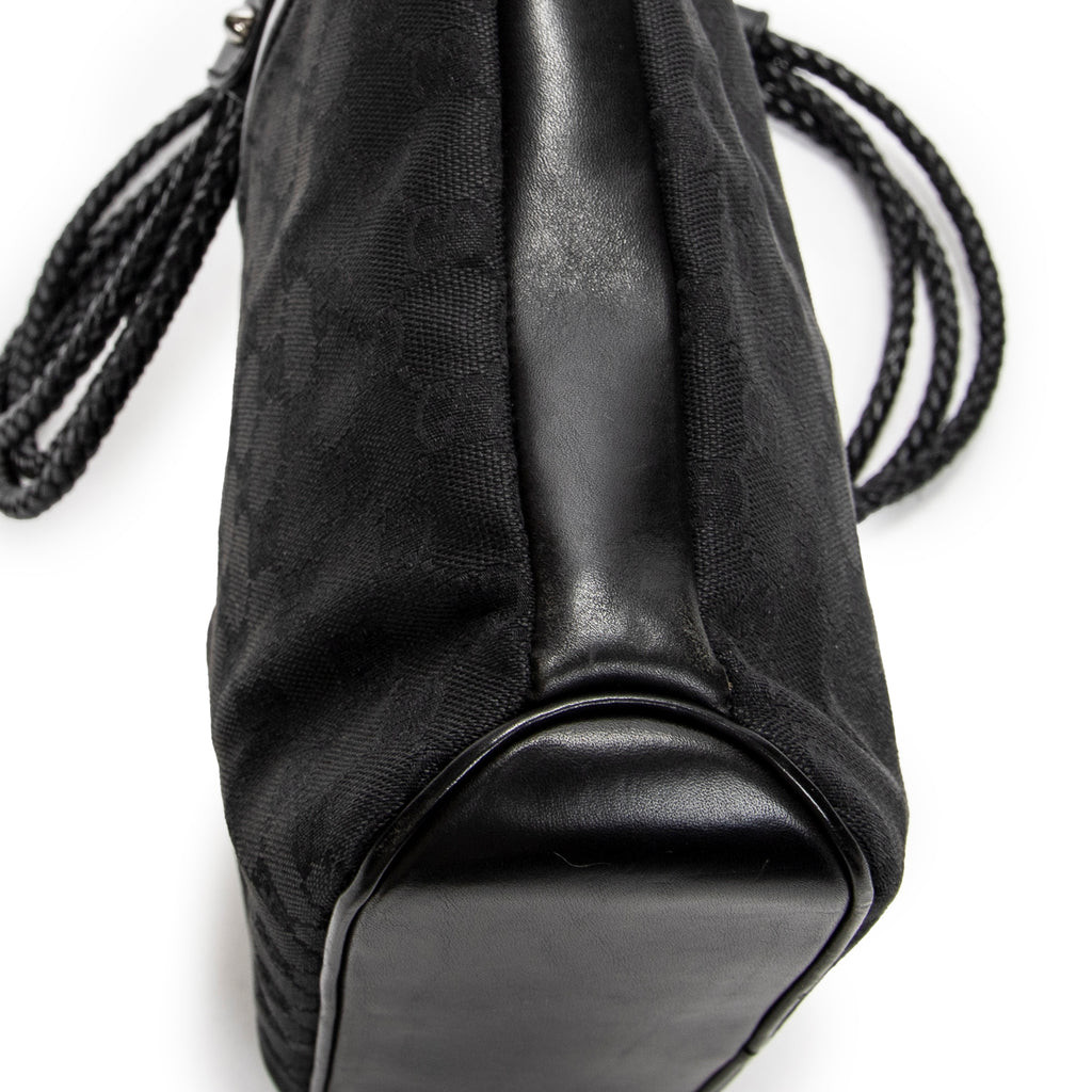 Bandolera con correa trenzada en lona monogramada negra
