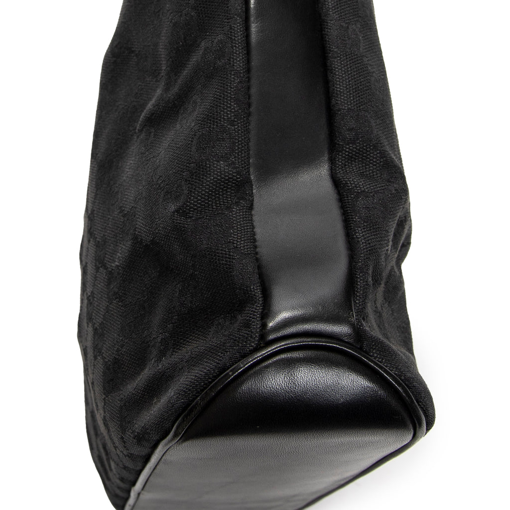 Bandolera con correa trenzada en lona monogramada negra