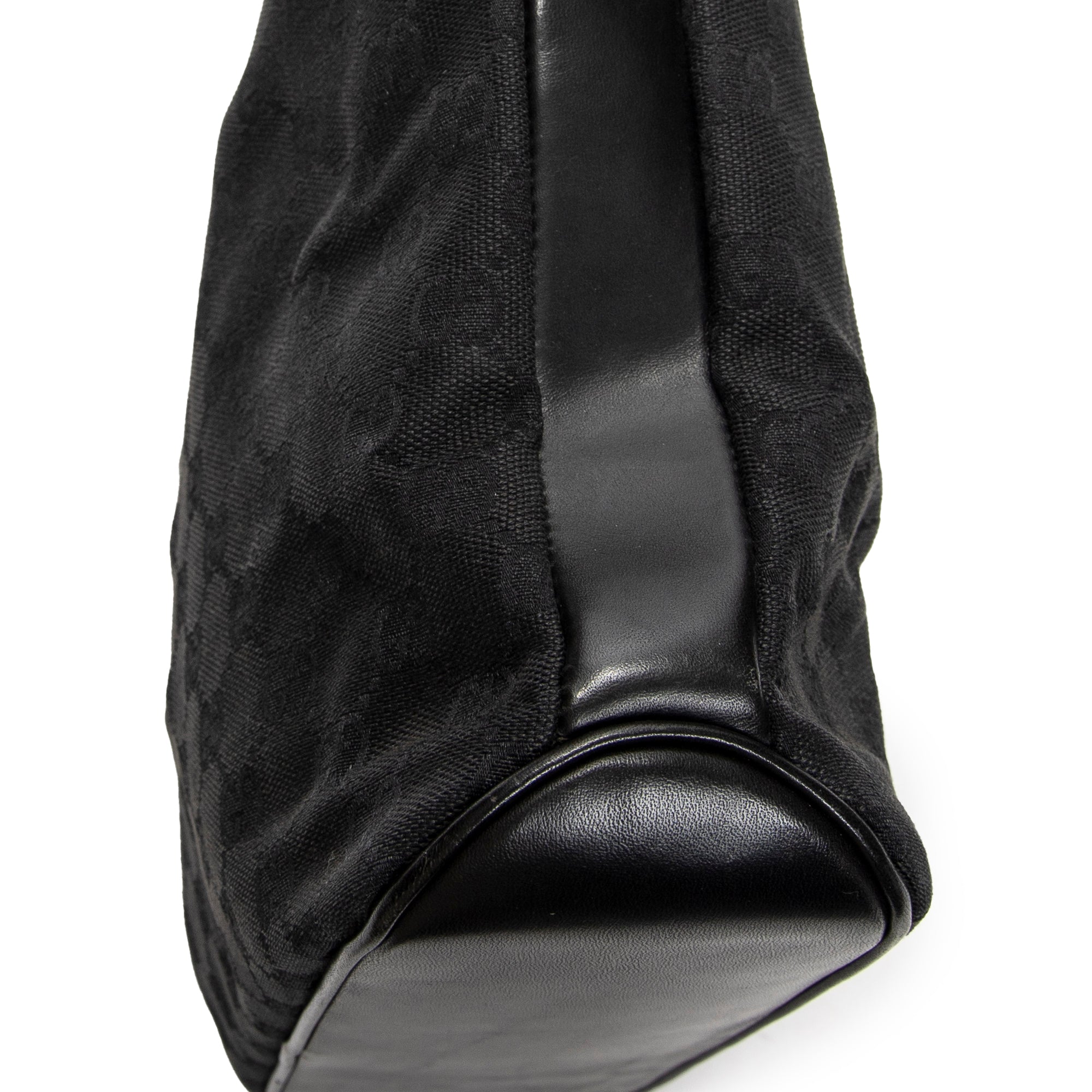 Bandolera con correa trenzada en lona monogramada negra