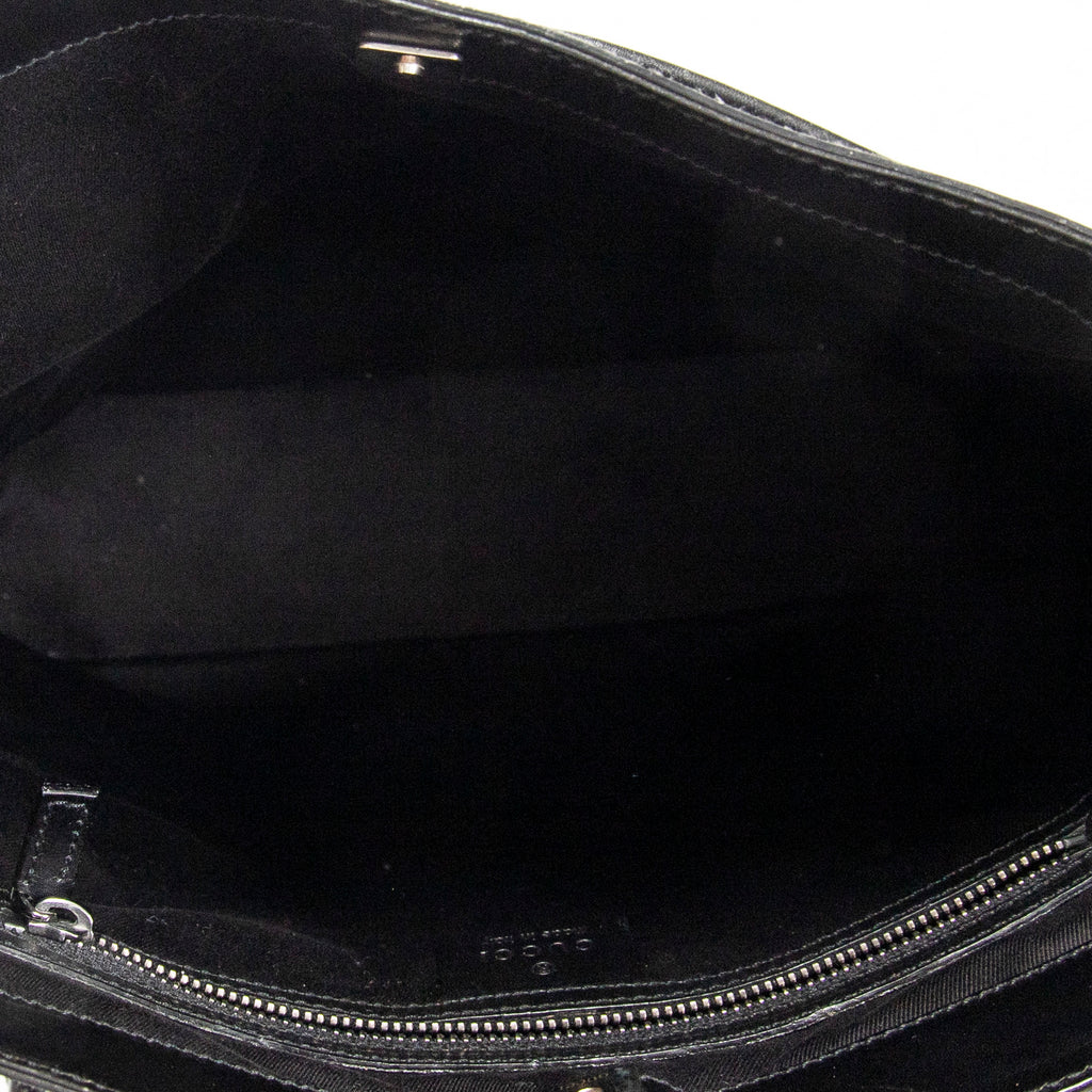 Bandolera con correa trenzada en lona monogramada negra