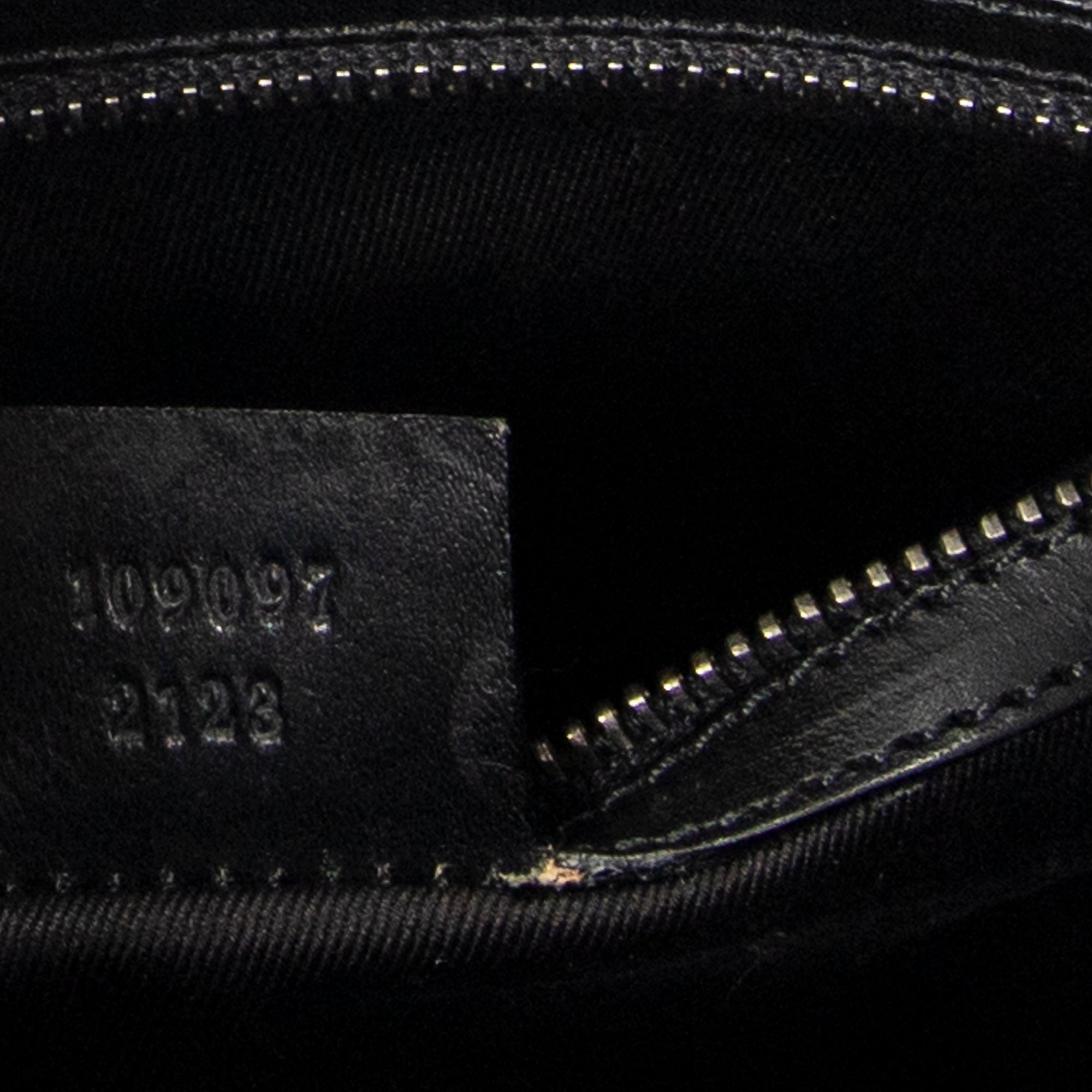 Bandolera con correa trenzada en lona monogramada negra