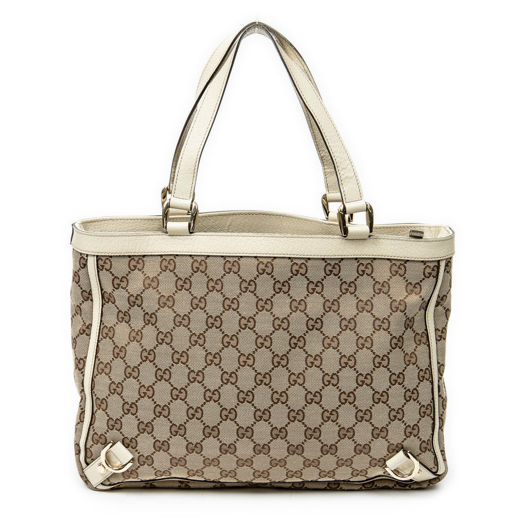 Bolso de hombro mediano Abbey Tote con anilla en D y monograma de lona en color marfil