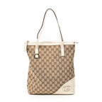 Bolso de Hombro Vertical Britt Tote Lona Monogram Marfil