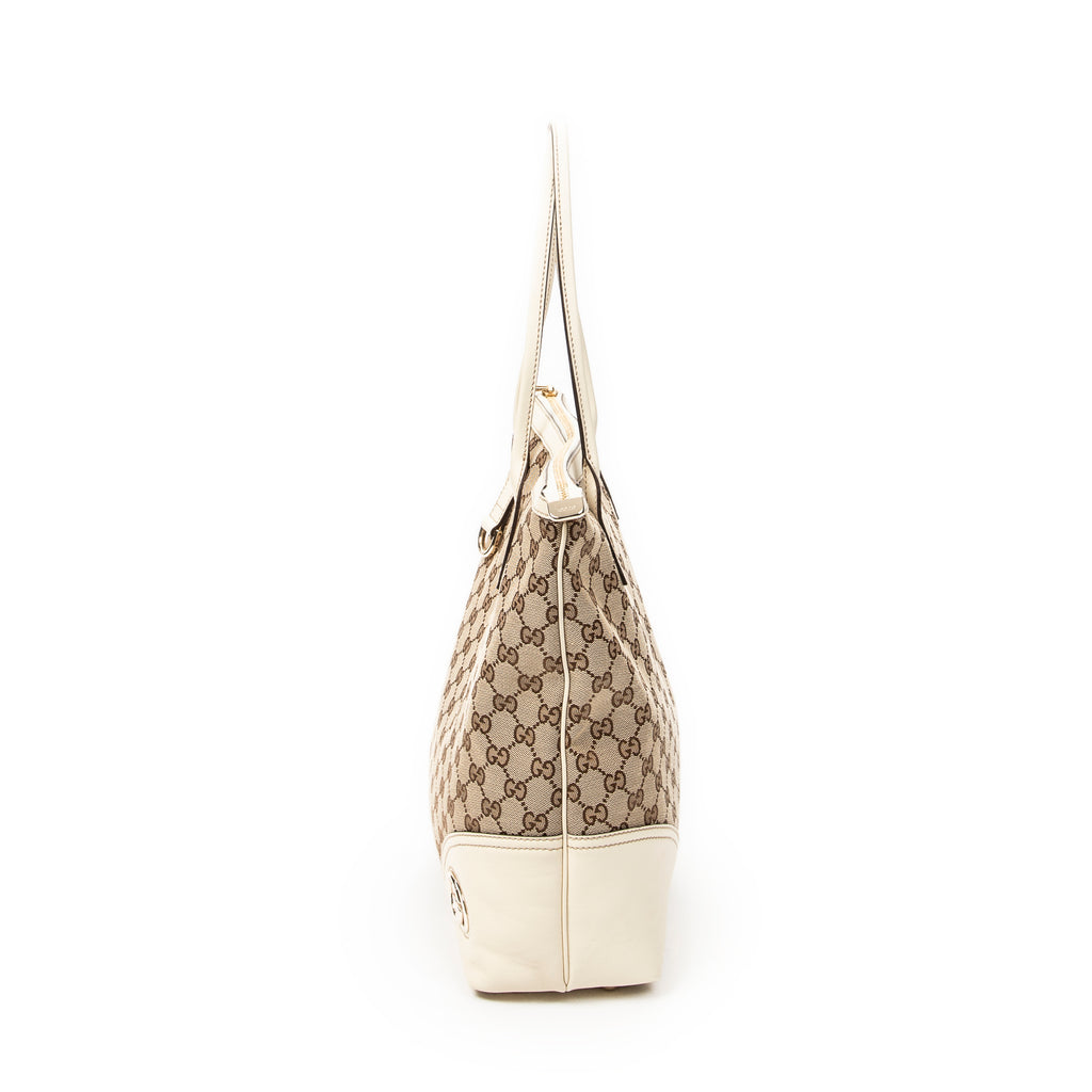 Bolso de Hombro Vertical Britt Tote Lona Monogram Marfil