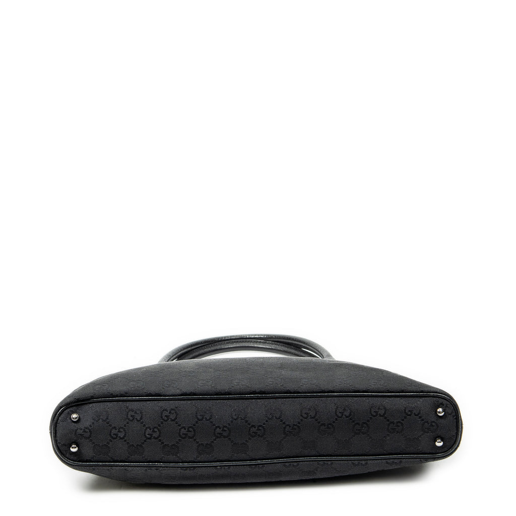 Bolso de hombro horizontal de lona jacquard negra con monograma