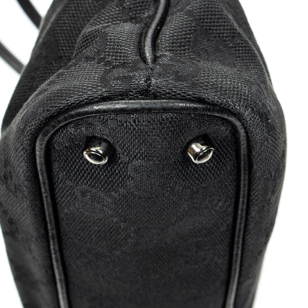 Bolso de hombro horizontal de lona jacquard negra con monograma