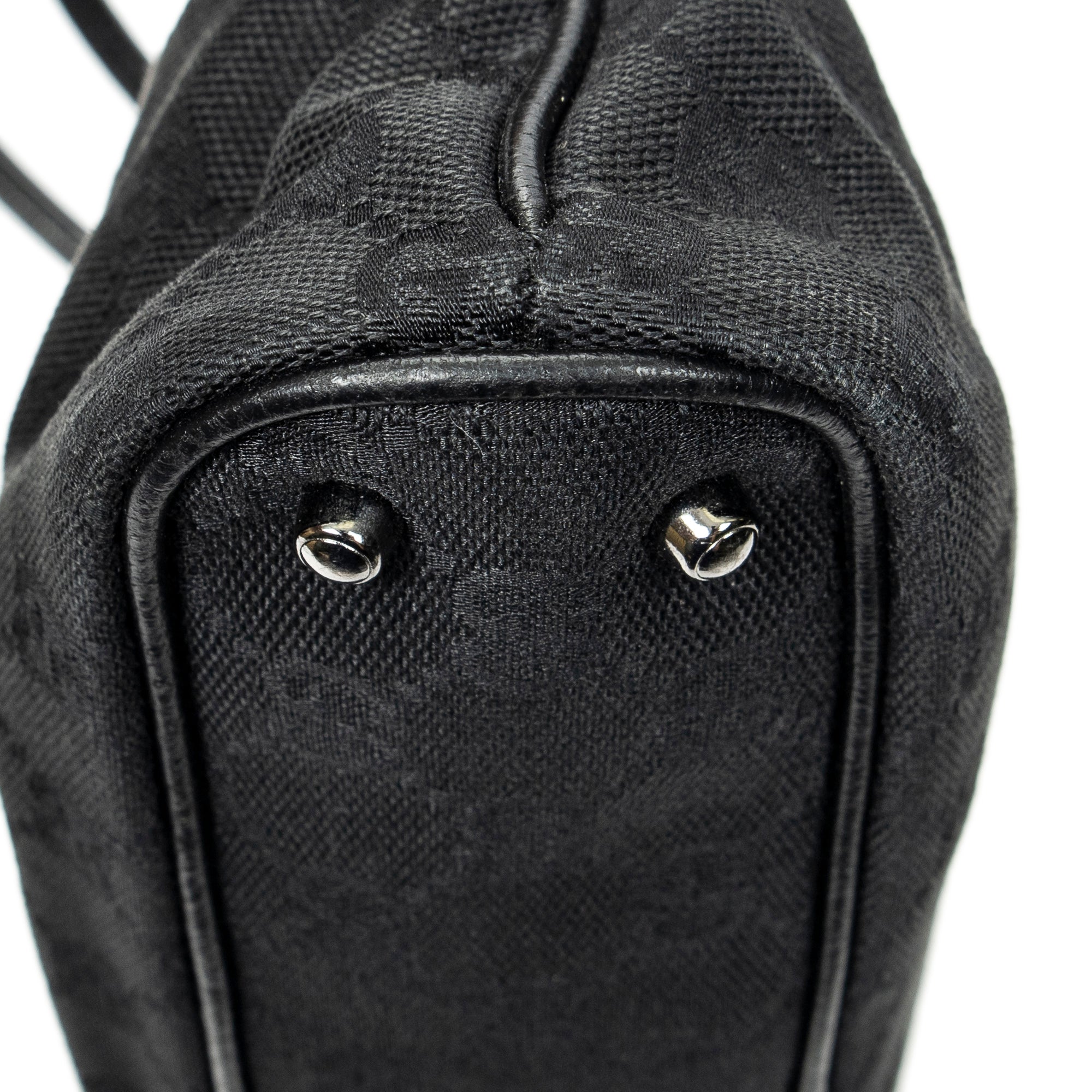 Bolso de hombro horizontal de lona jacquard negra con monograma