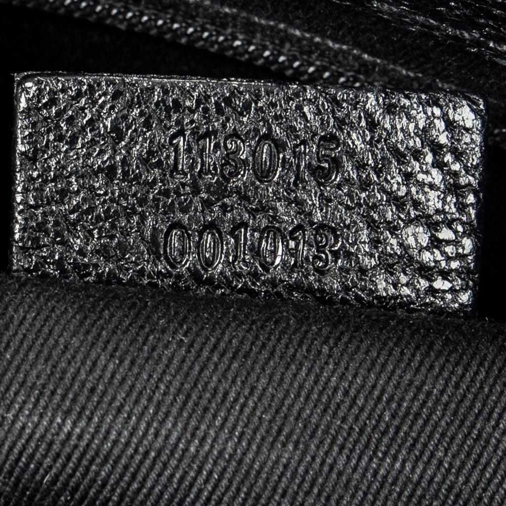 Bolso de hombro horizontal de lona jacquard negra con monograma