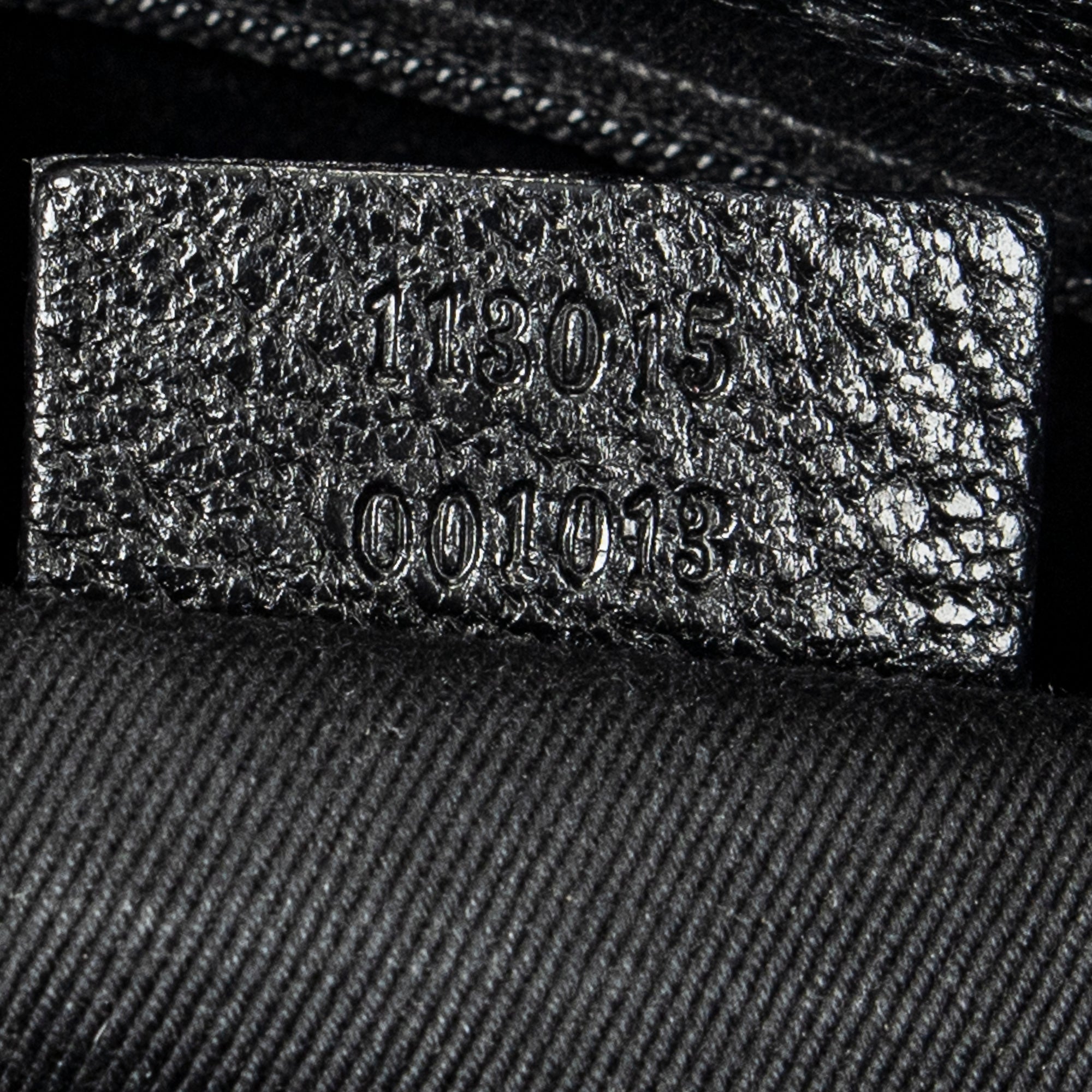 Bolso de hombro horizontal de lona jacquard negra con monograma