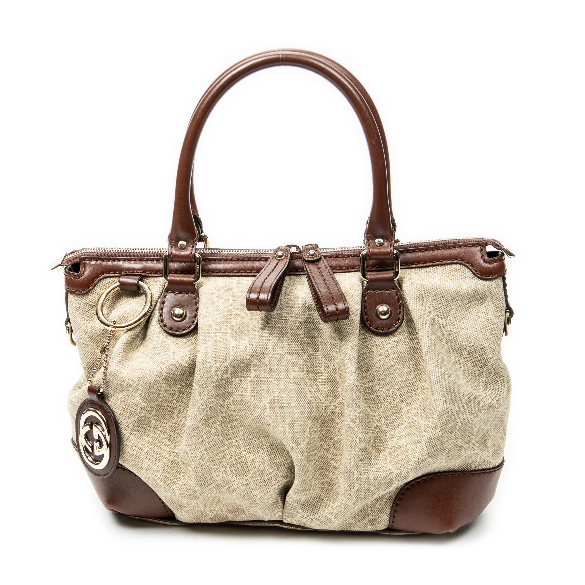 Bolso de hombro Sukey de lona monogramada beige con asa superior