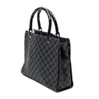Bolso de mano de lona con monograma negro y bambú