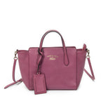 Sac bandoulière Mini Swing Tote en cuir de veau grainé rose