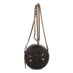 Sac à bandoulière rond en caviar noir filigrané