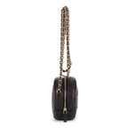 Sac à bandoulière rond en caviar noir filigrané