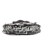 Bolso de hombro XS Le Cagole de piel de becerro negra con grafiti