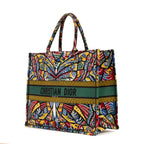 Bolso de hombro edición limitada de lona estampada con libro de mariposas en verde