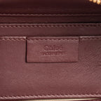 Bandolera pequeña Roy Clutch Piel de becerro burdeos