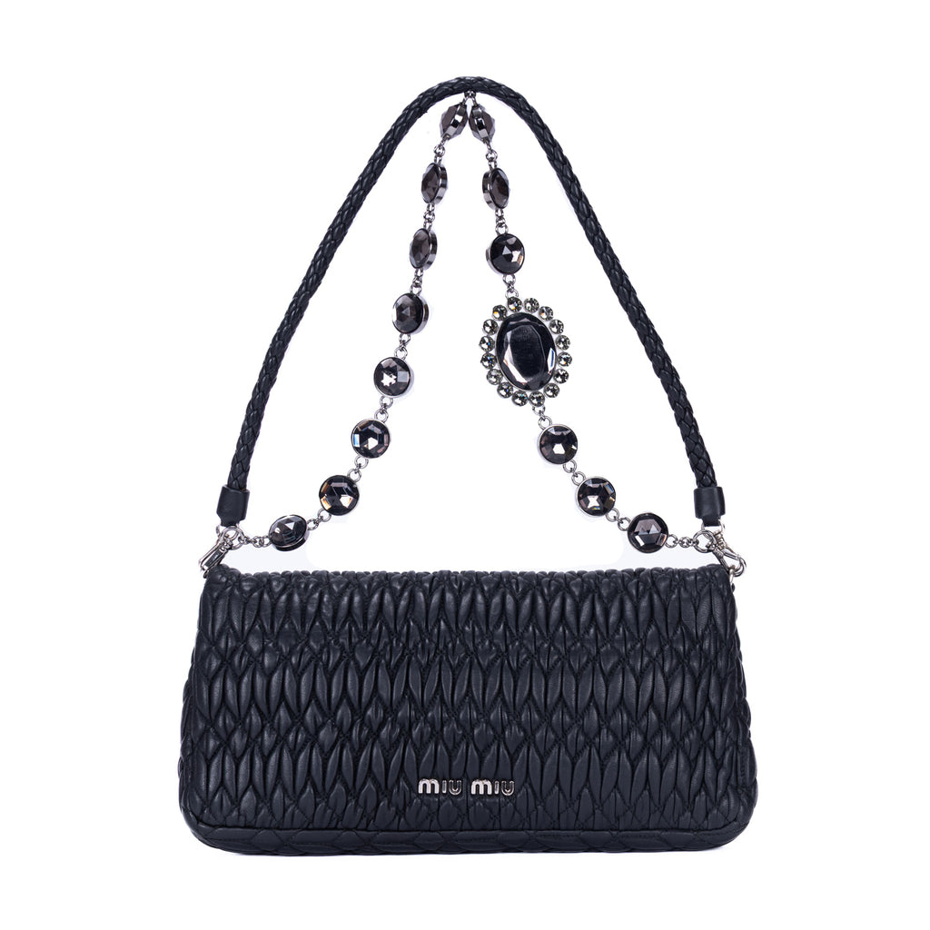 Clutch de cristal con efecto cloqué en piel de napa negra Gaufre