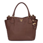 Bolso tote con bolsillos laterales de piel Vitello Daino marrón