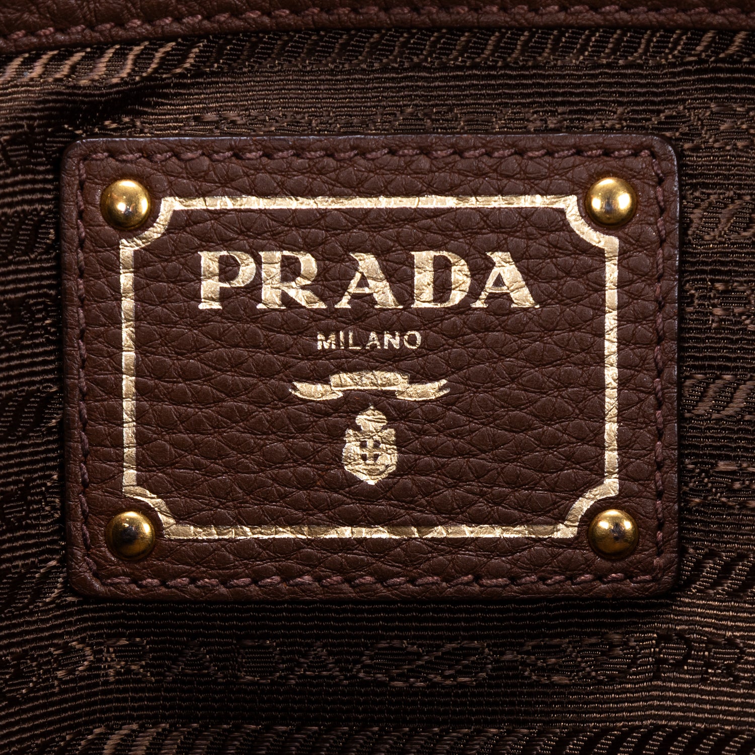 Bolso tote con bolsillos laterales de piel Vitello Daino marrón