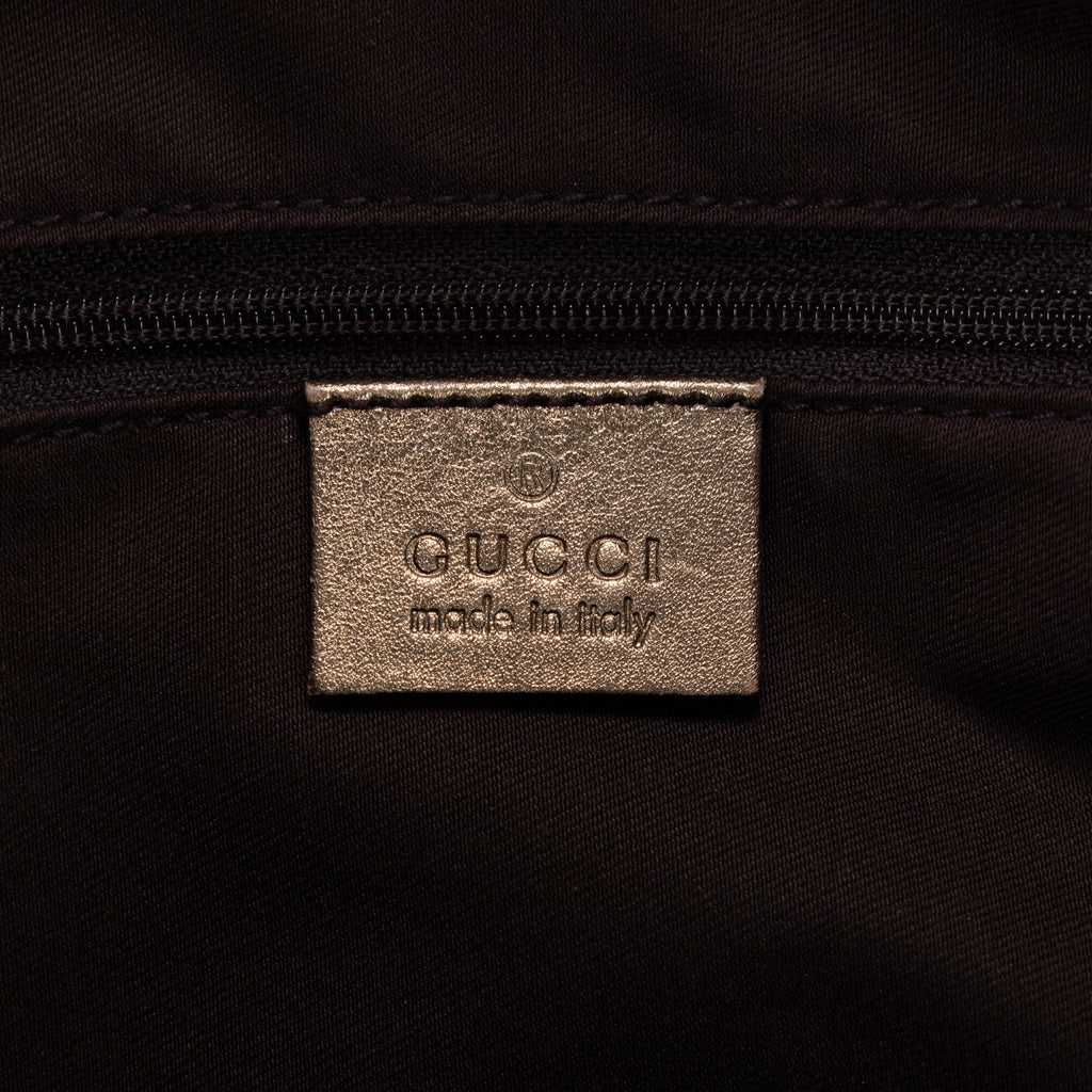 Bolso Abbey de aro D de lona monogram en marrón