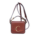 Sac à bandoulière Mini C Crossbody en cuir de veau marron