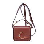 Sac à bandoulière Mini C Crossbody en cuir de veau marron