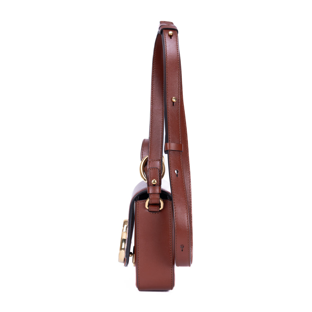 Sac à bandoulière Mini C Crossbody en cuir de veau marron