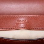 Sac à bandoulière Mini C Crossbody en cuir de veau marron