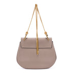 Sac porté épaule Drew petit modèle en cuir de veau grainé taupe
